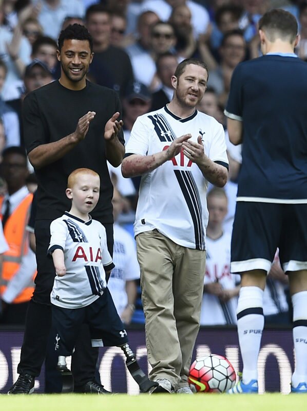 Britain Soccer Football - Tottenham Hotspur v Southampton - Barclays Premier League - White Hart Lane - 8/5/16 Tottenham Hotspur's Mousa Dembele with fan Marshall Janson at half time Reuters / Dylan Martinez Livepic EDITORIAL USE ONLY. No use with unauthorized audio, video, data, fixture lists, club/league logos or "live" services. Online in-match use limited to 45 images, no video emulation. No use in betting, games or single club/league/player publications. Please contact your account representative for further details.