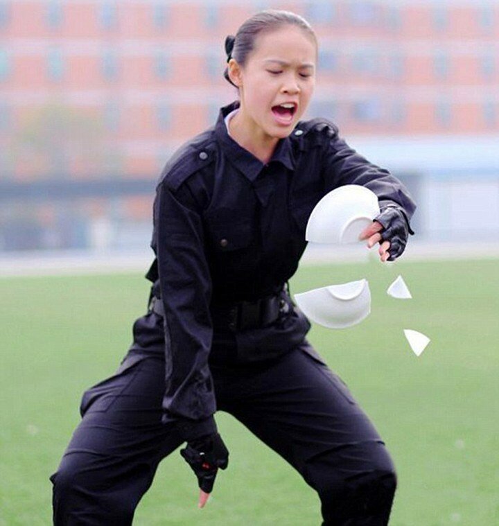 Pic shows: Flight attendants in one of their courses in hand-to-hand combat to be prepared for in-flight emergencies. Rowdy air passengers better watch their steps and their manners on flights to China in future. For Chinese flight attendants are now fully trained in unarmed combat to tackle nuisance travellers. Male and female stewards have been put through military-style training to prepare them for in-flight emergencies before graduating from their flight academies. The no-nonsense training has been going on at the aviation vocational school in Chengdu, capital of southwest China’s Sichuan Province. And it means the trolley dollys are in peak physical condition having taken courses in hand-to-hand combat before taking to the skies. Undergraduates are put their their paces come rain or shine and learn how to grapple and do somersaults to deal with any situation. One female student Lin Li said: " We are prepared for anything from a drunk passenger to a terrorist. "Our military training and taekwondo classes start from year one. They strengthen our bodies and prepare our anti-terrorism abilities and speed of reaction. "Besides these classes, we obviously also take etiquette classes as we need to look after and be nice to the passengers so they will feel safe and want to travel with us again." Phew, that's okay then. (ends)